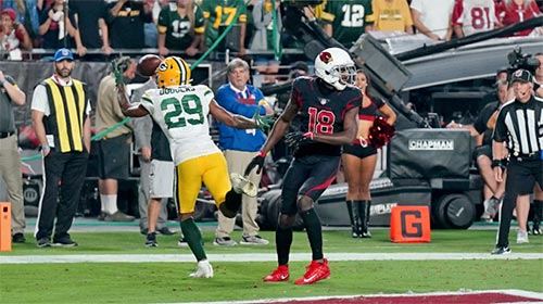 Green Bay Packers cornerback Rasul Douglas (29) intercepts a pass intended for Arizona Cardinals wide receiver A.J. Green (18) in the end zone.